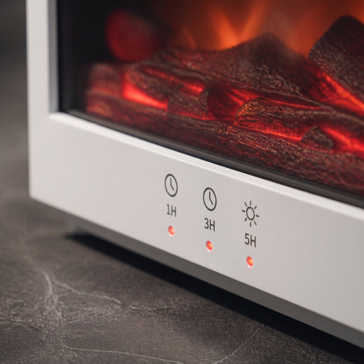 Close-up of the white fireplace flame diffuser's timer and lighting control buttons (1H, 3H, 5H) with glowing red LED indicators, showing illuminated burning embers in the background