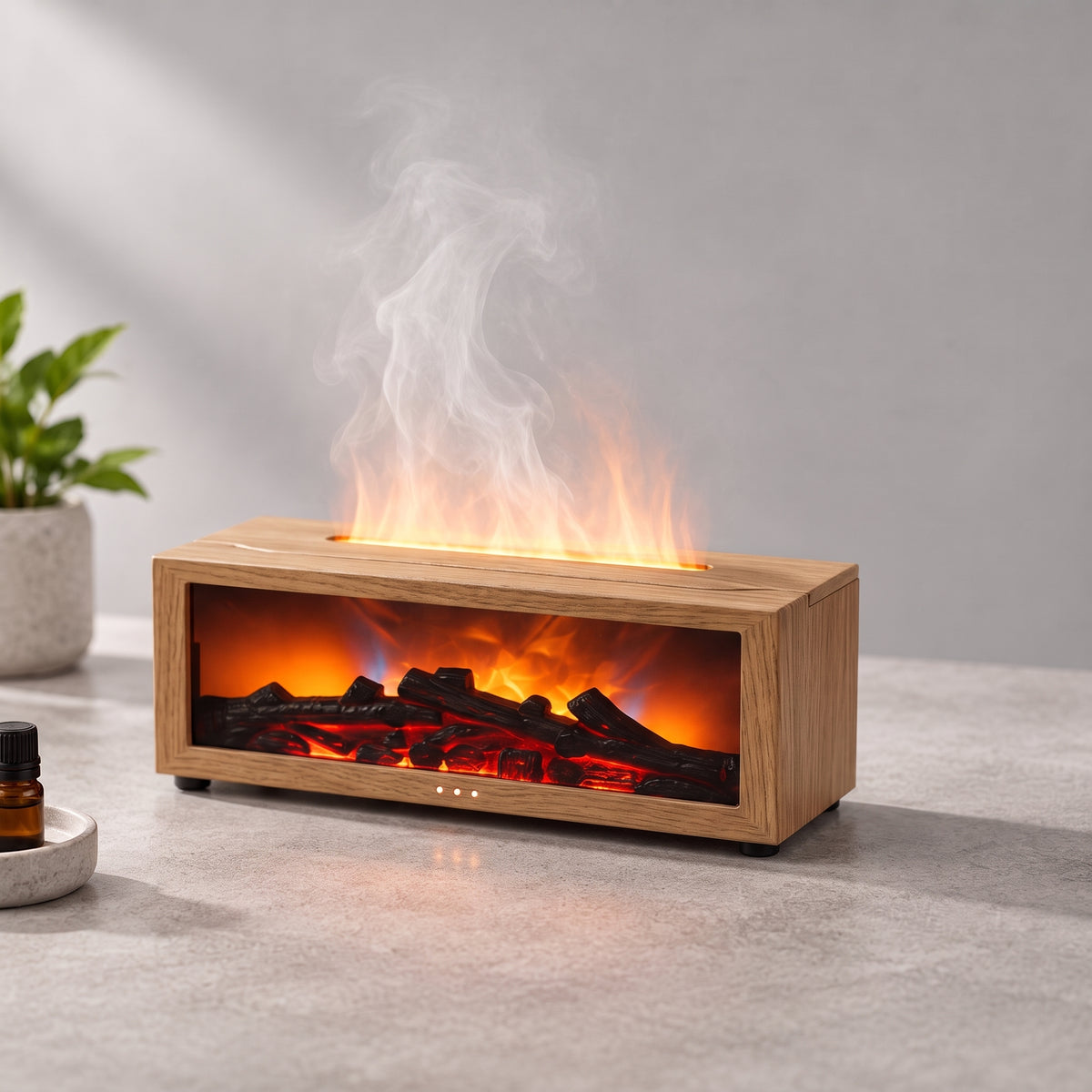 Wood grain flame mist diffuser with orange LED fireplace light and essential oil bottle on grey stone countertop