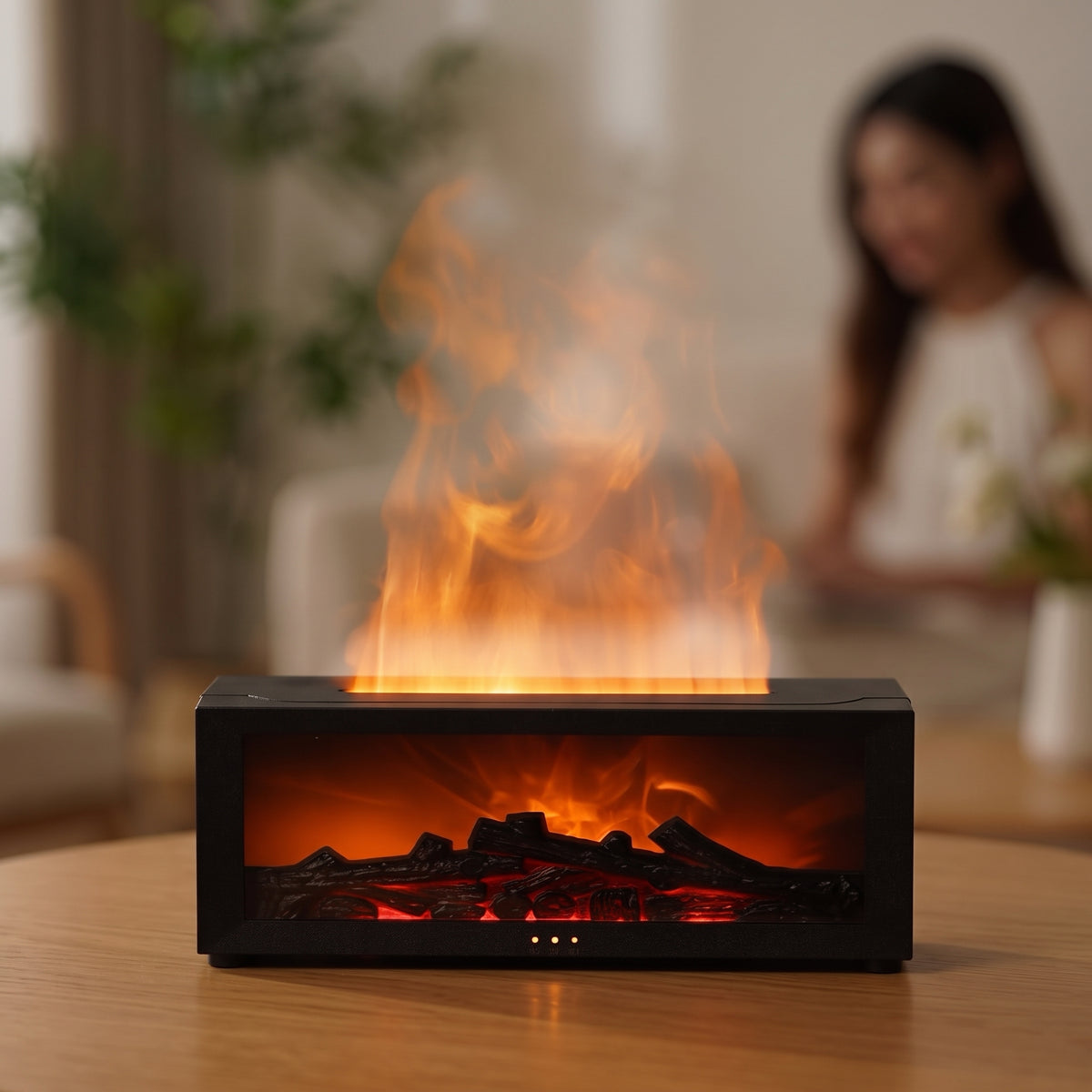 Modern black flame mist diffuser featuring an orange LED flame effect and glowing log display in a cozy home interior setting.